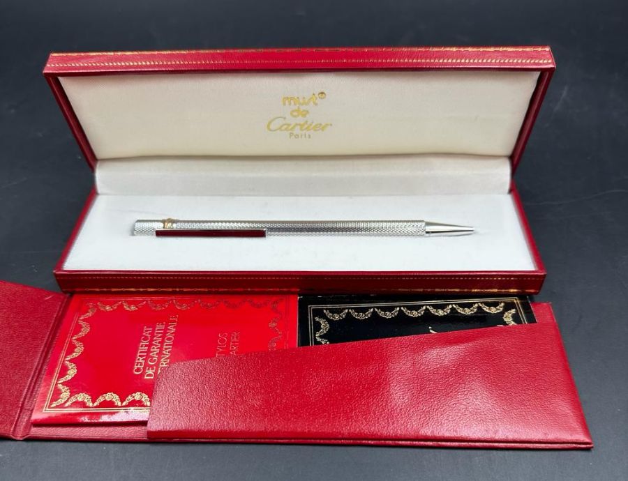 A Must De Cartier boxed Ballpoint pen in original box with card etc.