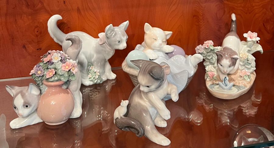 A selection of Lladro cats and Nao