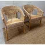 A pair of wicker armchairs