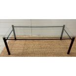 A Mid Century glass coffee table on a metal frame (H37cm W110cm D50cm)