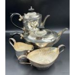 A Four Piece silver tea service to include teapot, hot water jug, sugar bowl and milk jug by A