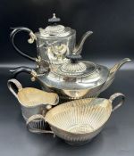 A Four Piece silver tea service to include teapot, hot water jug, sugar bowl and milk jug by A
