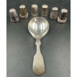 A silver caddy spoon and six silver thimbles, various hallmarks and makers