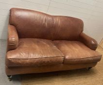 Three seater leather sofa and side chair (H81cm W180cm D93cm)