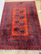 A red ground rug with geometric pattern (190cm x 133cm)