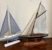 Two racing yachts on stands, blue and white sails (40cm x 55cm)