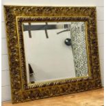 A wooden gold painted hall mirror in the rococo style 86x76