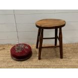 A small oak stool and a red ground floral upholstered foot stool