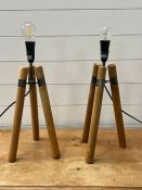 A pair of contemporary tripod lamps