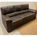 A three seater brown mocha leather sofa by Fenwicks