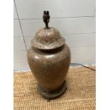 A ginger jar style lamp on a brass base