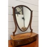 A shield back toilet mirror with three drawers to base (63cm x 41cm)