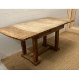 A 1930's oak extending draw leaf industrial style dining table (H75cm W103cm D84cm)