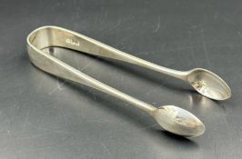 A pair of hallmarked sugar tongs, London by Josiah Williams & Co