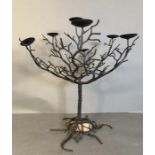 A wrought iron tea light tree. height 55cm