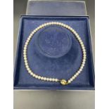 A pearl necklace with yellow gold, marked 585, clasp with inset pearl.