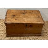 A pine blanket box with iron hinges along with a selection of paper back books (H33cm W69cm D45cm)