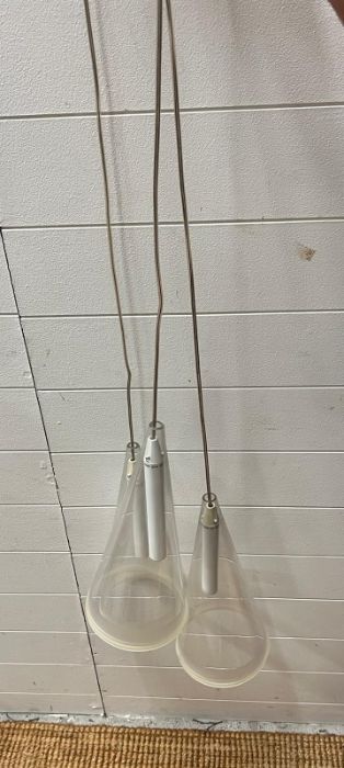 A Mid Century three light lantern, the three clear conical drop down on cords