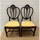 A pair of federal harp back chairs in yellow upholstery