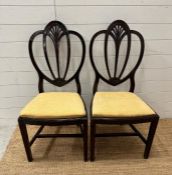 A pair of federal harp back chairs in yellow upholstery