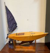 A wooden racing boat model on stand (H115cm W80cm)