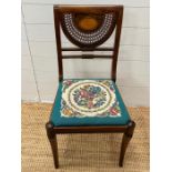 An inlaid and cane side chair