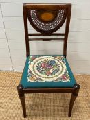 An inlaid and cane side chair