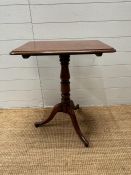 A mahogany pedestal occasional table on turned centre column ending in splayed feet (H72cm W59cm