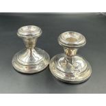 Two silver squat candlesticks by Lady Atkins marked Sterling silver AF, one with no weighted base.