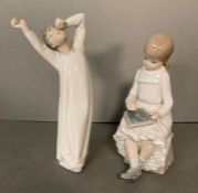 Two Lladro figures- A young boy yawning and a young girl doing homework