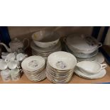 A dinner service by Royal Limoges France, twelve dinner plates, twelve bowls, lidded serving dishes,