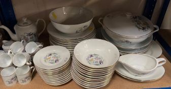 A dinner service by Royal Limoges France, twelve dinner plates, twelve bowls, lidded serving dishes,