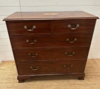 An Edwardian mahogany two over three chest of drawers with string inlay and inlay to top on block