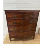 A two over three mahogany bow fronted chest of drawers, brass drop handles on splayed legs.(H