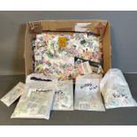 A selection of loose and packaged UK and World stamps, various counties and ages