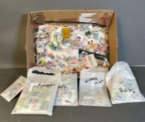 A selection of loose and packaged UK and World stamps, various counties and ages