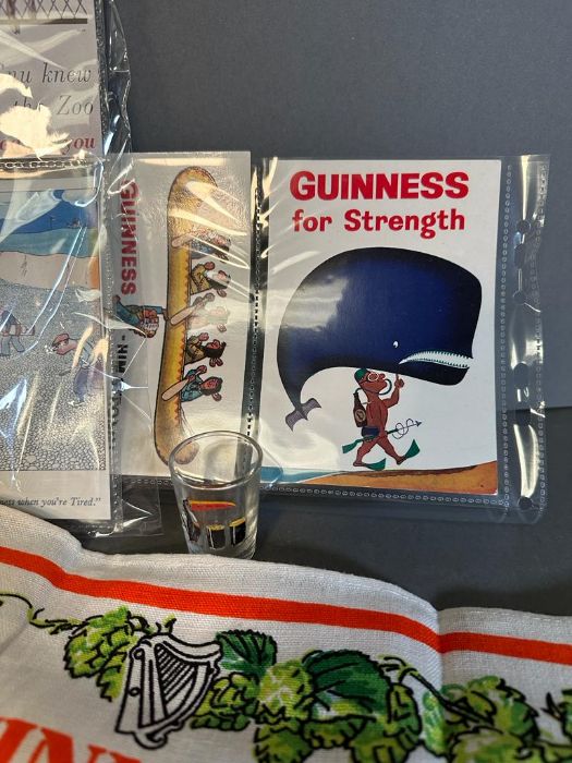 A selection of Guinness collectable to include tea towel, shot glass, calendar and postcards - Image 4 of 5