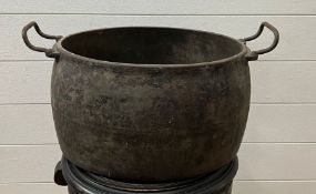 A large metal cooking pot