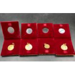 A selection of gold coins mounted as pendants in Asian gold. Two 1912 Half Sovereigns (Approximate