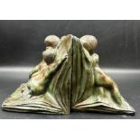 A pair of bronzed book ends