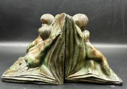 A pair of bronzed book ends