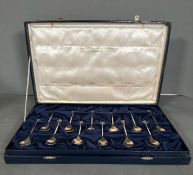 A Boxed set of twelve sterling silver and silver gilt astrological spoons, produced in 1979 and a