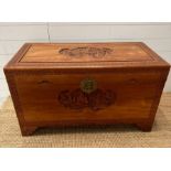 A Camphor chest with Oriental carving depicting boats in a harbour scene with floral boarder ( H