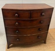 A bow front two over three mahogany chest of drawers (H104cm W104cm D52cm)