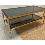 A brass coffee table with smoked glass (H40cm W90cm D46cm)