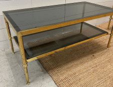 A brass coffee table with smoked glass (H40cm W90cm D46cm)