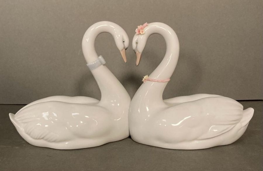 A pair of Lladro necking swans