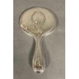 A hallmarked silver vanity mirror.