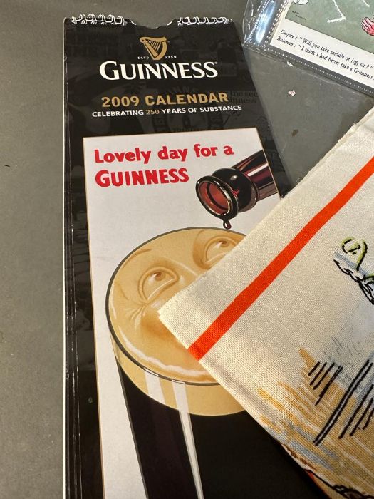 A selection of Guinness collectable to include tea towel, shot glass, calendar and postcards - Image 5 of 5