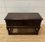 A small oak coffer floral carving to front (H 42cm x 67cm x 31cm)